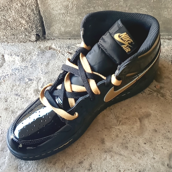Dressed in a Black and Metallic Gold color scheme.